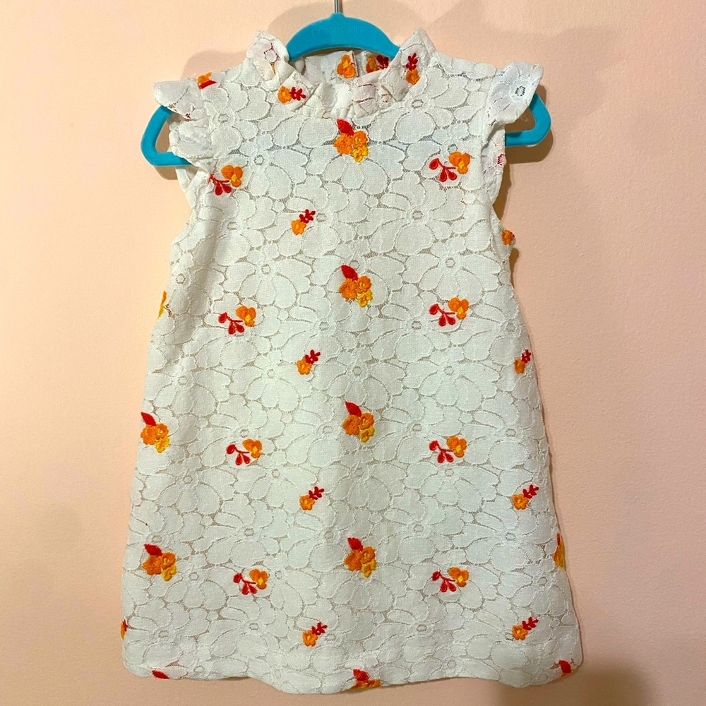 White lace baby dress with floral embroidery